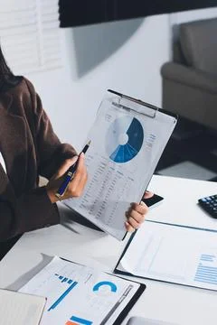 Accountants processing financial documents and taxes, managing corporate fi.. Foto stock