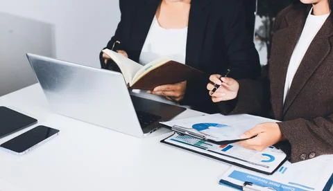 Accountants processing financial documents and taxes, managing corporate fi.. Foto stock