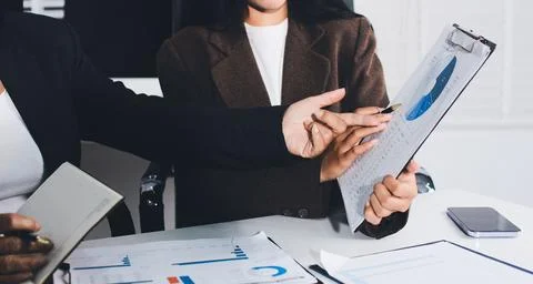 Accountants processing financial documents and taxes, managing corporate fi.. Foto stock