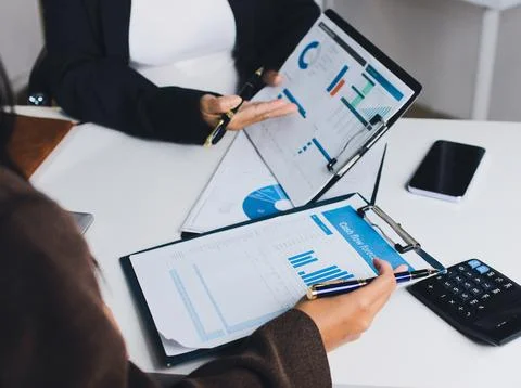 Accountants processing financial documents and taxes, managing corporate fi.. Foto stock
