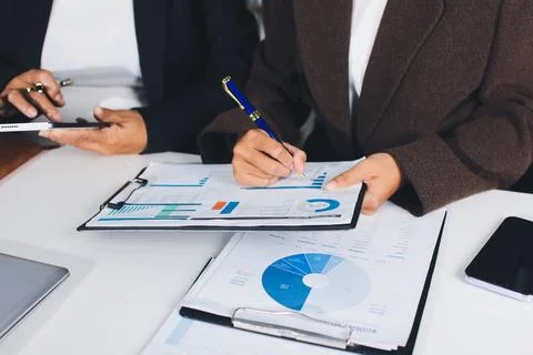 Accountants processing financial documents and taxes, managing corporate fi.. Foto stock