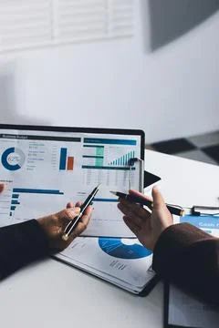 Accountants processing financial documents and taxes, managing corporate fi.. Foto stock