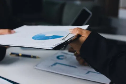Accountants processing financial documents and taxes, managing corporate fi.. Foto stock