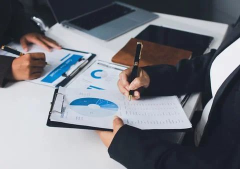 Accountants processing financial documents and taxes, managing corporate fi.. Stock Photos