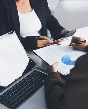 Accountants processing financial documents and taxes, managing corporate fi.. Stockfoto's