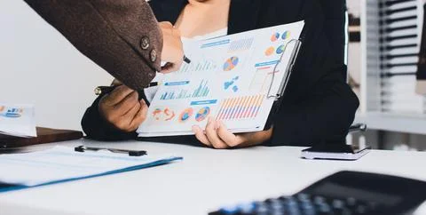 Accountants processing financial documents and taxes, managing corporate fi.. Stockfoto's