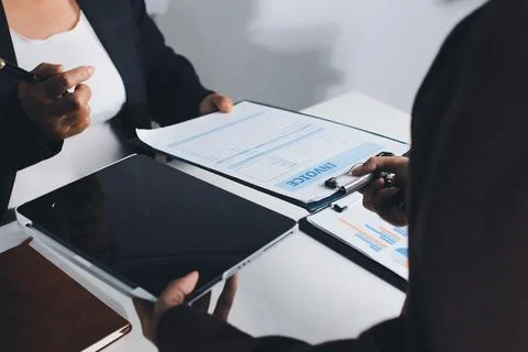 Accountants processing financial documents and taxes, managing corporate fi.. Foto stock