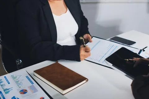 Accountants processing financial documents and taxes, managing corporate fi.. Foto stock