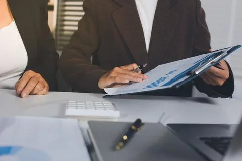 Accountants processing financial documents and taxes, managing corporate fi.. Stockfoto's