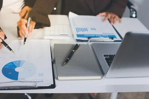 Accountants processing financial documents and taxes, managing corporate fi.. Stockfoto's