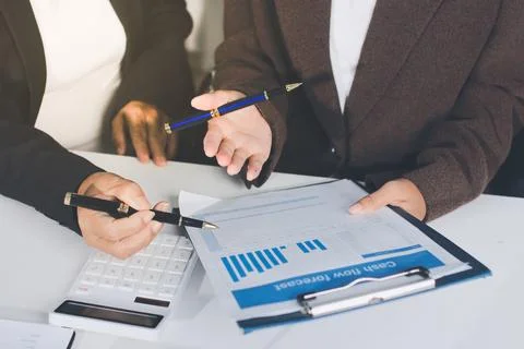 Accountants processing financial documents and taxes, managing corporate fi.. Stockfoto's