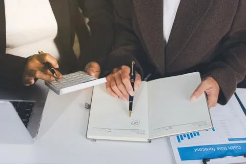 Accountants processing financial documents and taxes, managing corporate fi.. Stockfoto's