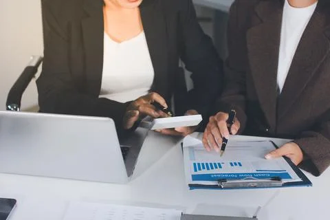 Accountants processing financial documents and taxes, managing corporate fi.. Stockfoto's