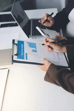 Accountants processing financial documents and taxes, managing corporate fi.. Stockfoto's