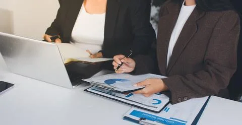 Accountants processing financial documents and taxes, managing corporate fi.. Stockfoto's