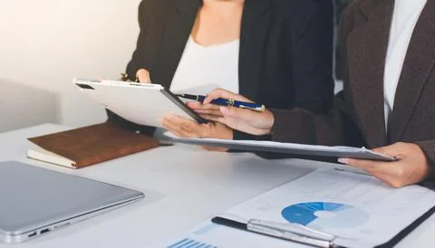 Accountants processing financial documents and taxes, managing corporate fi.. Stockfoto's