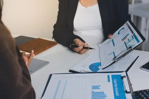 Accountants processing financial documents and taxes, managing corporate fi.. Stockfoto's