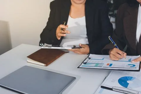 Accountants processing financial documents and taxes, managing corporate fi.. Stockfoto's