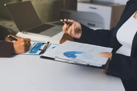 Accountants processing financial documents and taxes, managing corporate fi.. Stockfoto's