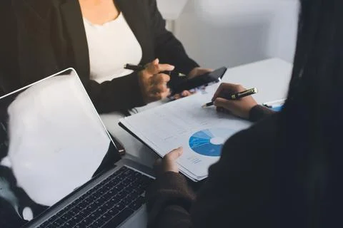 Accountants processing financial documents and taxes, managing corporate fi.. Stockfoto's