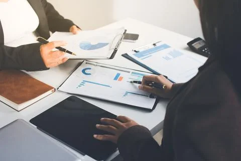 Accountants processing financial documents and taxes, managing corporate fi.. Stockfoto's