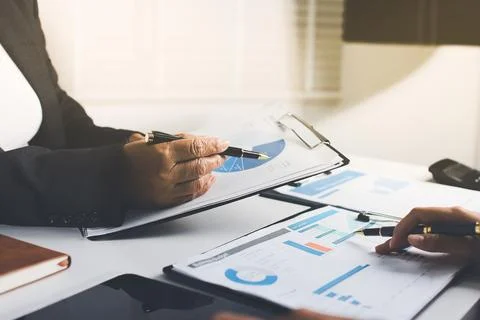 Accountants processing financial documents and taxes, managing corporate fi.. Stock Photos