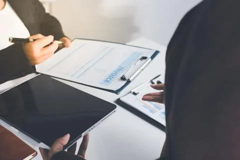 Accountants processing financial documents and taxes, managing corporate fi.. Stockfoto's