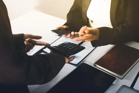 Accountants processing financial documents and taxes, managing corporate fi.. Stockfoto's