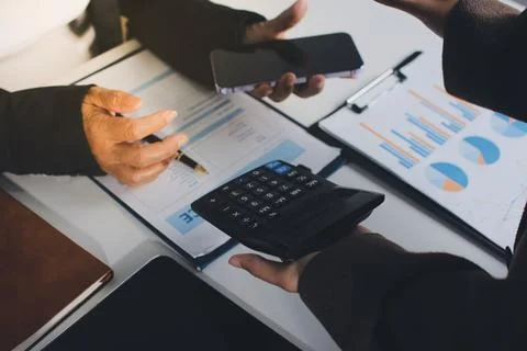 Accountants processing financial documents and taxes, managing corporate fi.. Stock Photos