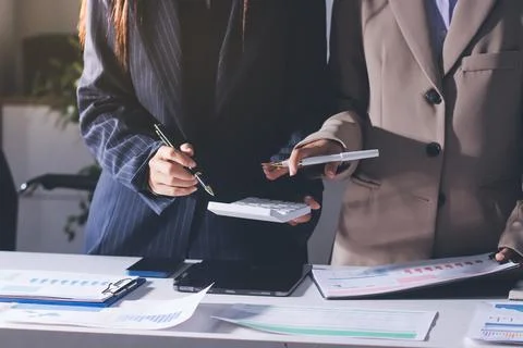Accountants processing financial documents and taxes, managing corporate fi.. 스톡 사진