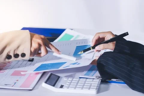 Accountants processing financial documents and taxes, managing corporate fi.. 스톡 사진