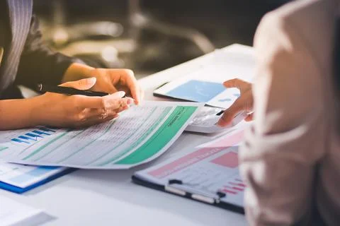 Accountants processing financial documents and taxes, managing corporate fi.. 스톡 사진