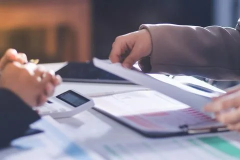 Accountants processing financial documents and taxes, managing corporate fi.. 스톡 사진