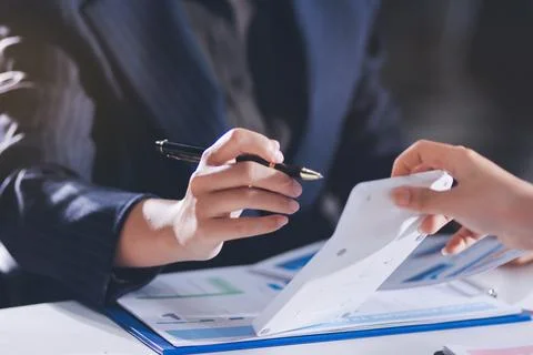 Accountants processing financial documents and taxes, managing corporate fi.. 스톡 사진
