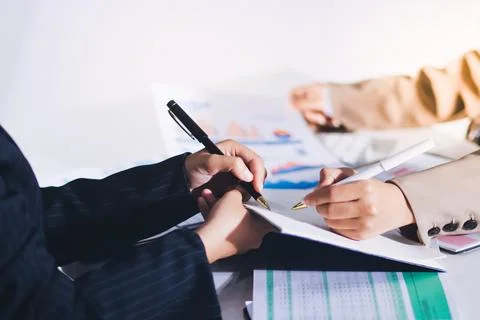 Accountants processing financial documents and taxes, managing corporate fi.. 스톡 사진
