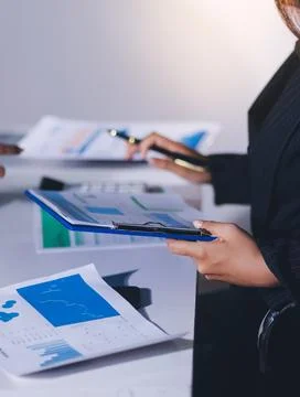 Accountants processing financial documents and taxes, managing corporate fi.. 스톡 사진