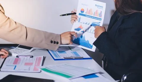 Accountants processing financial documents and taxes, managing corporate fi.. 스톡 사진