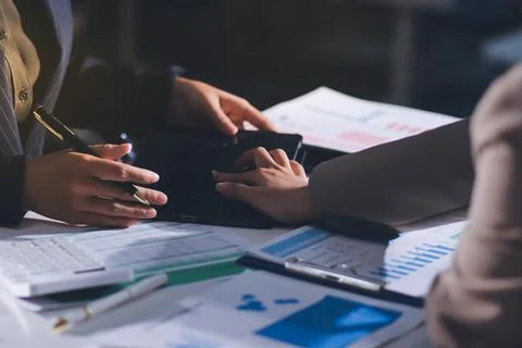 Accountants processing financial documents and taxes, managing corporate fi.. 스톡 사진