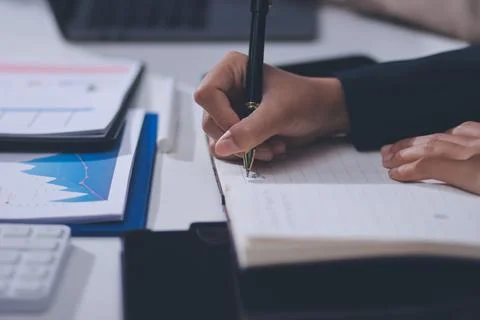 Accountants processing financial documents and taxes, managing corporate fi.. Stockfoto's