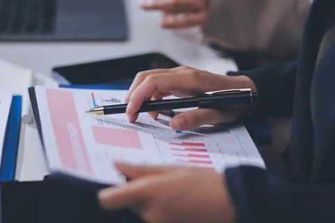 Accountants processing financial documents and taxes, managing corporate fi.. 스톡 사진