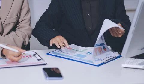 Accountants processing financial documents and taxes, managing corporate fi.. 스톡 사진