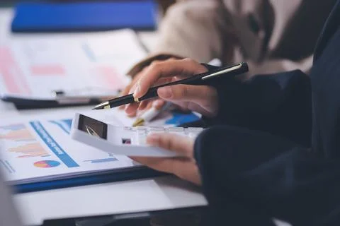 Accountants processing financial documents and taxes, managing corporate fi.. 스톡 사진