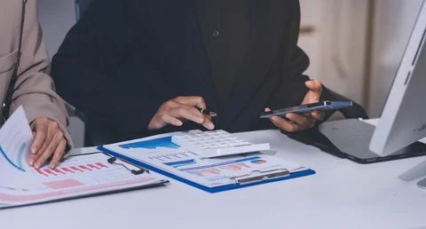 Accountants processing financial documents and taxes, managing corporate fi.. 스톡 사진