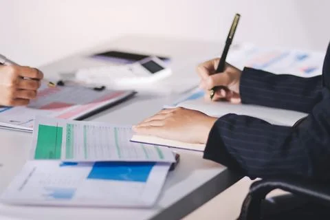 Accountants processing financial documents and taxes, managing corporate fi.. Stock Photos