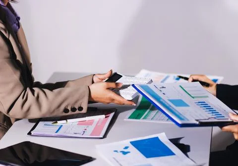 Accountants processing financial documents and taxes, managing corporate fi.. Stock Photos