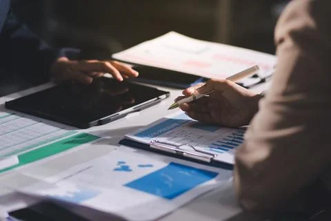 Accountants processing financial documents and taxes, managing corporate fi.. Stock Photos