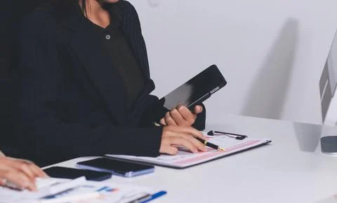 Accountants processing financial documents and taxes, managing corporate fi.. Stock Photos