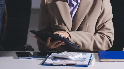 Accountants processing financial documents and taxes, managing corporate fi.. Stock Photos