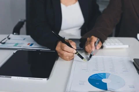 Accountants processing financial documents and taxes, managing corporate fi.. Stock Photos