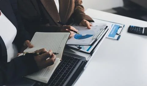 Accountants processing financial documents and taxes, managing corporate fi.. Stock Photos